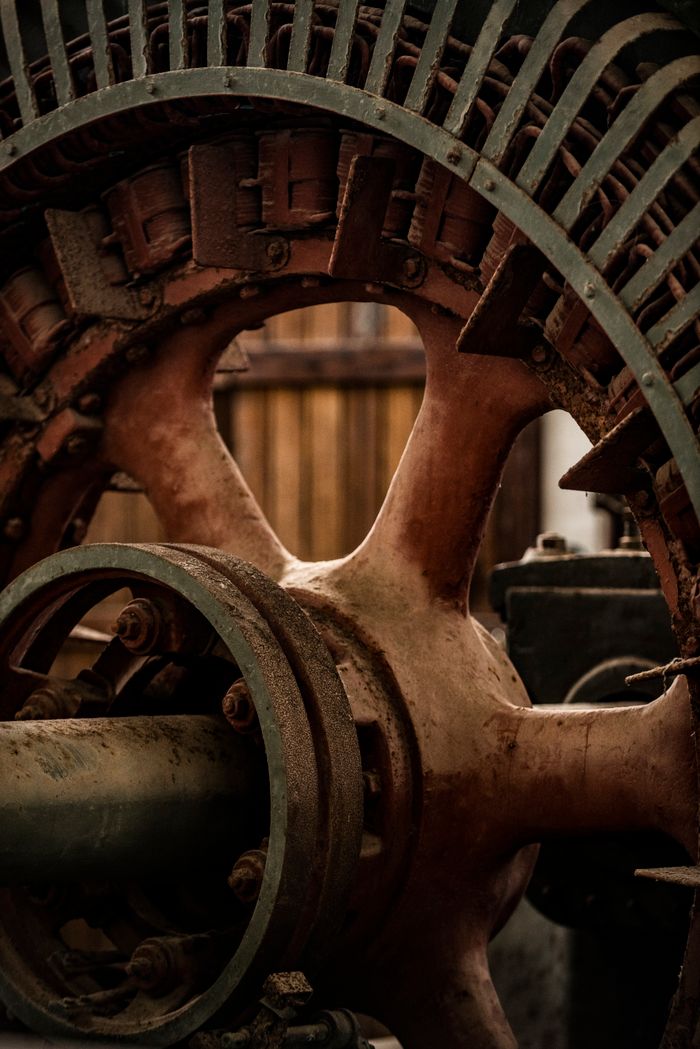 Close-up of rusty industrial machine showcasing metal components and texture.