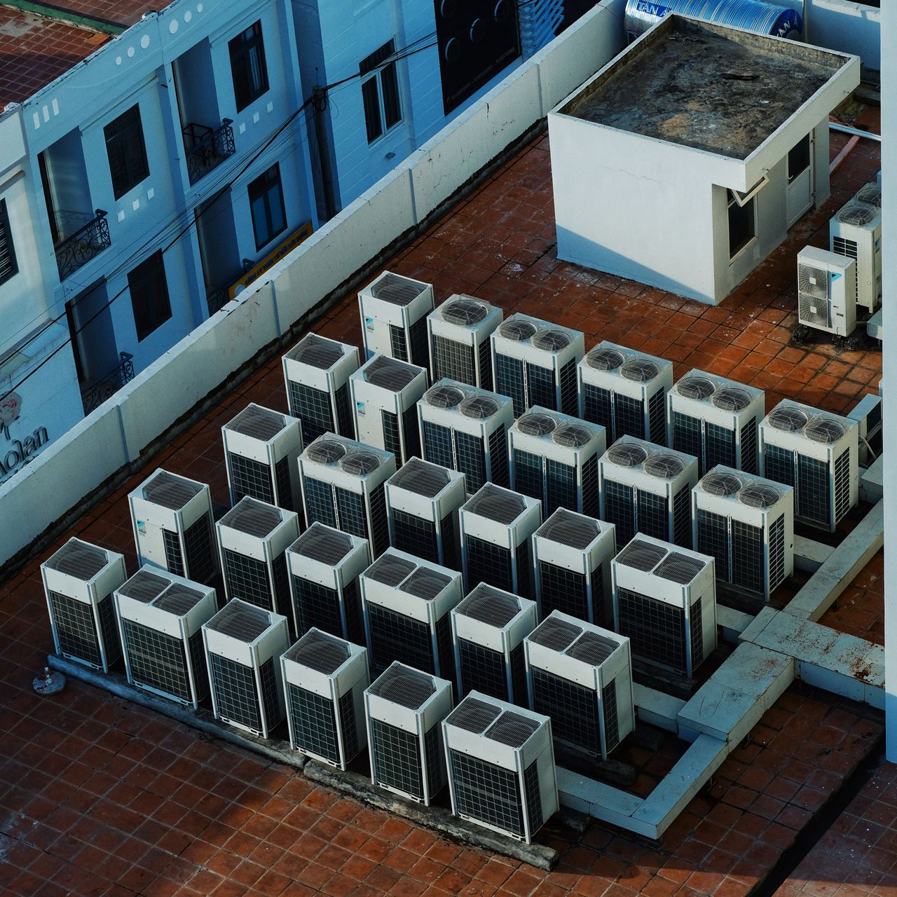 creative-03 High angle view of rooftop HVAC units on a building in Buon Ma Thuot, Vietnam.