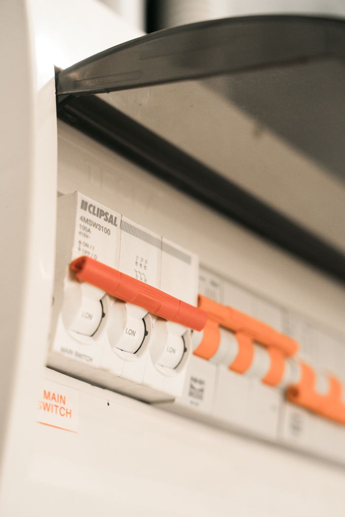 creative-03 Close-up view of Clipsal electrical circuit breakers in a distribution board.